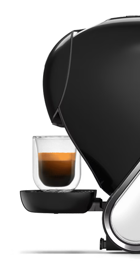 Comparativa entre una cafetera NEO Latte blanca y una cafetera NEO Caffè negra. El dedo de un alienígena duda entre las dos.